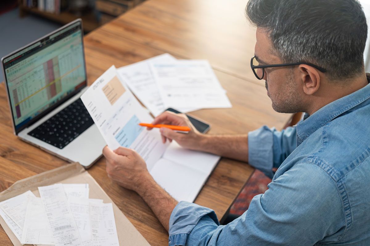 Man with billing documents